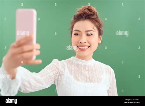 Portrait Of Kawaii Tender Young Asian Girl Taking Selfie Stock Photo