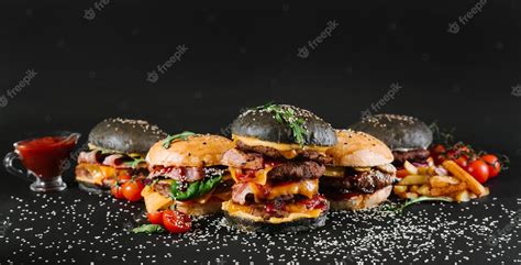 Premium Photo Many Different Burgers With Ingredients On A Black