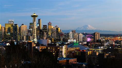 Evening Cityscape View Of The Seattle Skyline With Mount Rainier
