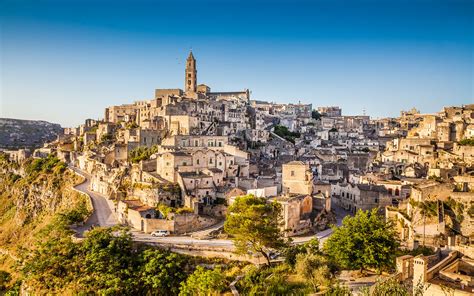 This area, the sassi di matera, is a complex of cave dwellings carved into the ancient river canyon. Matera, Italy: European Capital of Culture 2019 | Slow ...