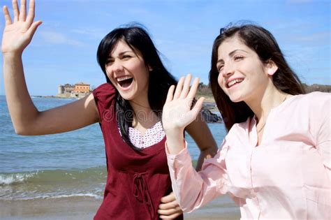 Two Girls Saying Hello To Friends Stock Image Image Of Attractive