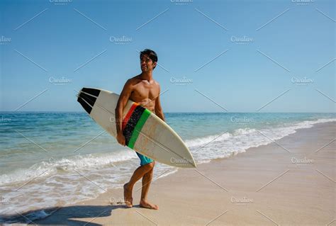 Man With Surf Board On Beach High Quality People Images ~ Creative Market