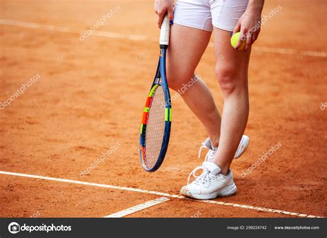 Female Tennis Player Legs In Tennis Shoes Standing On A Clay Cou Stock