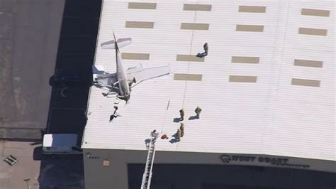 Small Plane Crash On Hangar Roof At Long Beach Airport Pilot Suffers