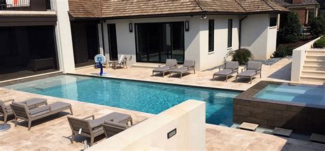 The expansive grounds are beautifully landscaped and include stone walls and stone sculptures. Premier Stone - Natural Stone Tile and Pavers