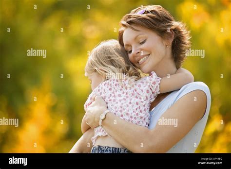 Mother Hugs Daughter Stock Photo Royalty Free Image 1459435 Alamy