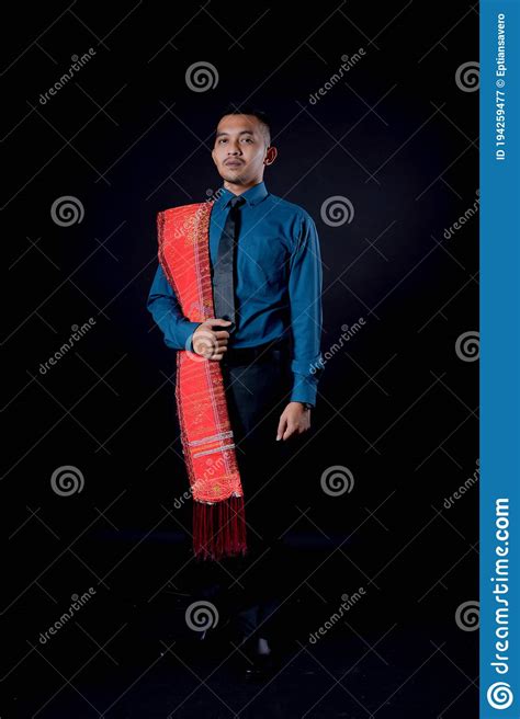 Portrait Of Beautiful Indonesian Man Wearing Traditional Batak Costume