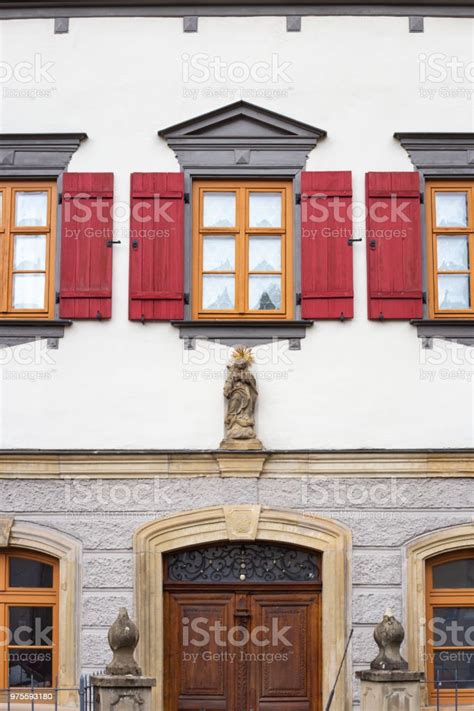 Framework Historical Building Facade With Red Window Shutters Stock