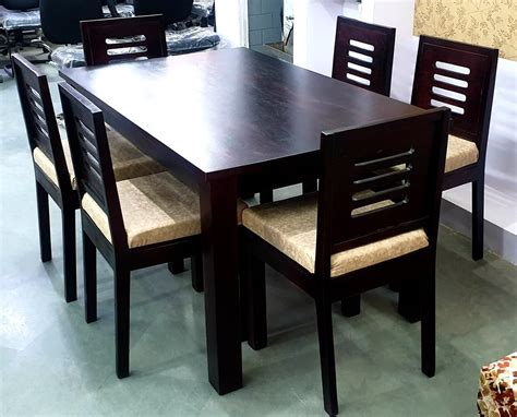 Rectangular dining tables are efficient tables that are available in a variety of sizes and proportions for seating two to twelve people. Dark Brown Wooden 6 Seater Dining Table, For Home, Size ...