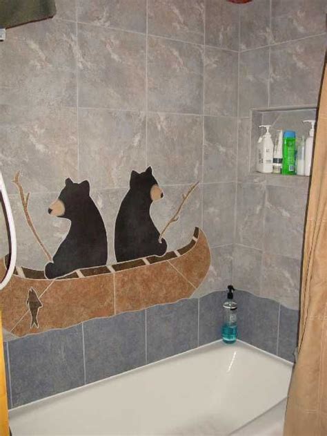 Decorations can easily become clutter in such a limited space. Shower tile with bears fishing from their canoe. Awesome ...