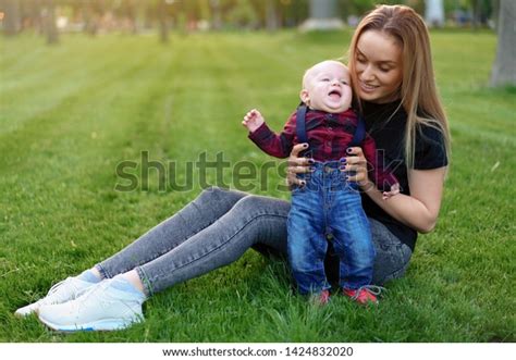 Beautiful Young Mother Walks Her Little Stock Photo 1424832020