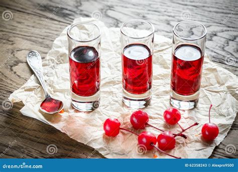 Glasses Of Cherry Brandy With Cocktail Cherries Stock Image Image Of Cherry Bowl 62358243