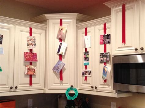 It's an easy diy version of expensive holiday decorations. Easy idea to display Christmas cards. Tape red ribbon to ...
