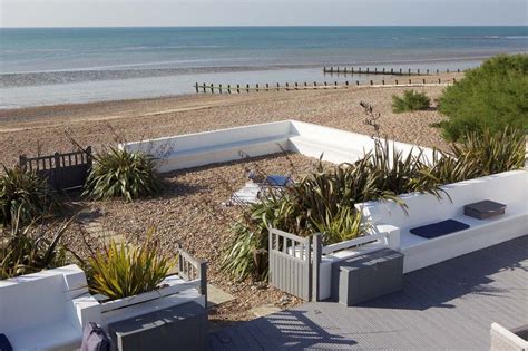Beach Garden And Decked Area By The Sea At New England Beach House