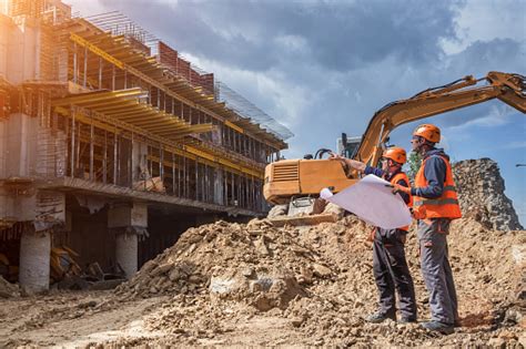 Hyundai engineering and construction co ltd stock. Engineers On Construction Site Stock Photo - Download ...