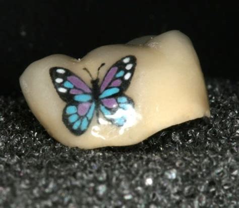 Traditional tattoos are made by placing pigment (typically ink) under your skin to create a permanent design. 15 Amazing Examples of Teeth Tattoos (Tatooth) - Body Art Guru