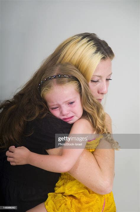 Mother Comforting Crying Girl High Res Stock Photo Getty Images