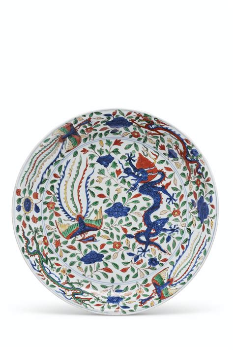 Chinese dragons are legendary creatures in chinese mythology and folklore. A RARE LARGE WUCAI 'DRAGON AND PHOENIX' DISH