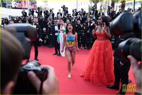 Topless Protester Storms The Red Carpet At Cannes 2022 Premiere See