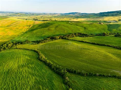 Stunning Aerial View Of Green Fields And Farmlands With Small Villages