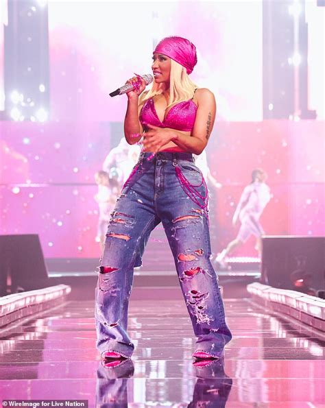 Nicki Minaj Showcases Her Curves In Skimpy Silver Bodysuit At Opening Night Of Pink Friday 2