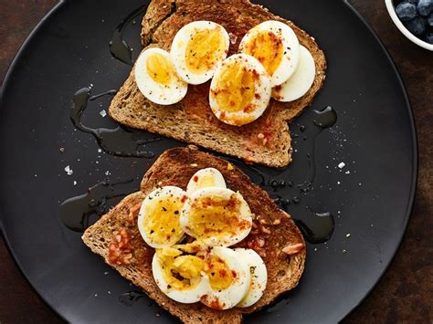 Perfect soft boiled eggs on fresh toast to add a little extra sunshine to a lazy weekend breakfast or brunch! Soft-Boiled Egg and Tomato Toast Recipe | SELF