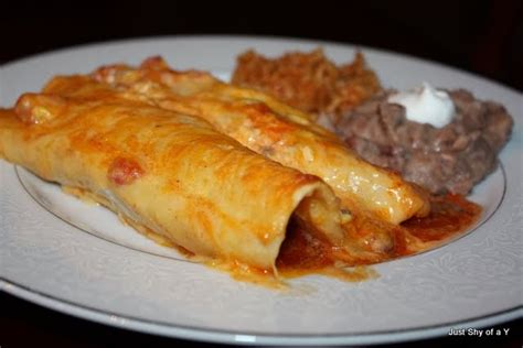 This beef enchiladas recipe is simple to make, made with the tastiest sauce, and it's sure to be a crowd favorite! Just Shy of a Y: cheesy beef enchiladas