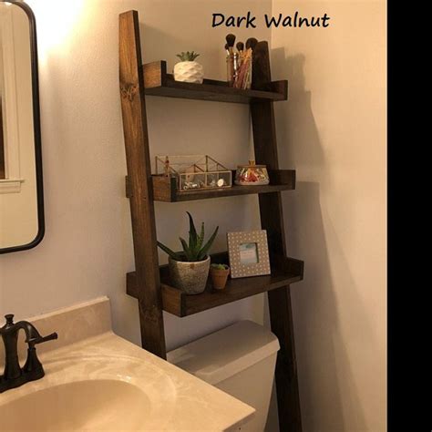 The foxborough storage unit has a slender metal frame with a black finish which gives it a big of an industrial appearance. Over the Toilet Ladder Shelf in 2020 (With images) | Over ...