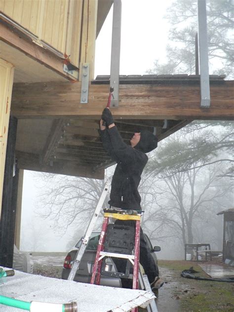 Removing a rusted nut can require patience and a light touch. 110213a Reengineering deck posts