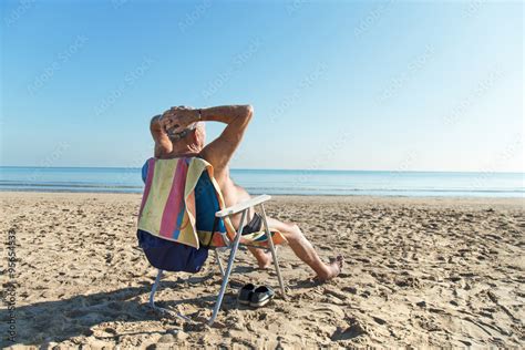 Old Man Sunbathing At The Beach Stock Foto Adobe Stock
