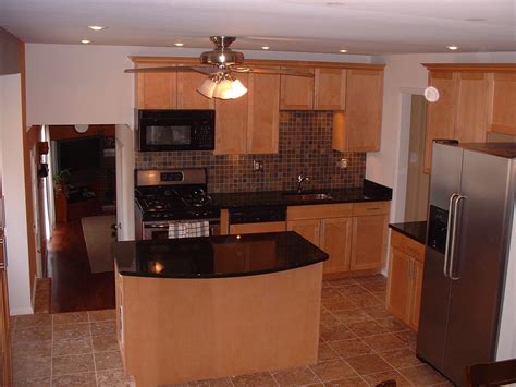 Kitchen with maple cabinets and real limestone flooring ...
