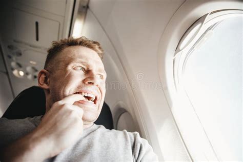 Male Passenger In Plane Screams And Cries Aerophobia Background Of