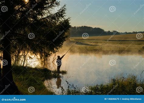 A Fisherman On A Wooded Lake In The Fog Stock Image Image Of