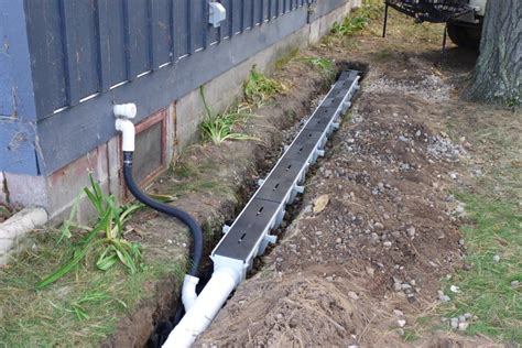 A french drain can work as a shield, collecting water before it reaches the patio and diverting it away. Installation of channel drain system (Dura Slope by NDS ...