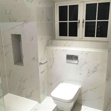 Marble look tiles have the design world buzzing, and it's easy to see why. Carrara White Porcelain Marble Effect Tiles 120x60cm | Porcel-Thin | Marble bathroom, Marble ...