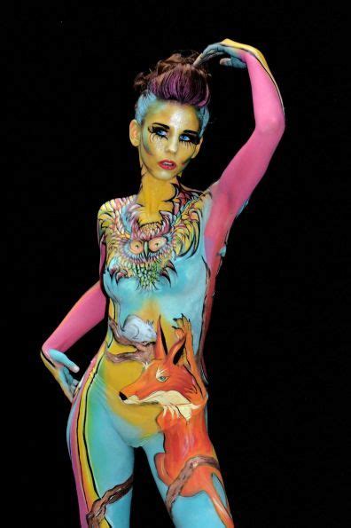A Participant Poses With Her Body Paintings Designed By Bodypainting