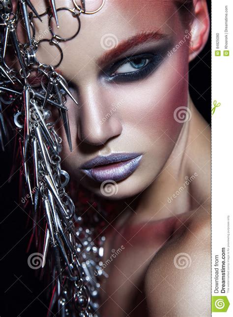 Fashion Beauty Model With Metallic Headwear And Shiny Silver Red Makeup