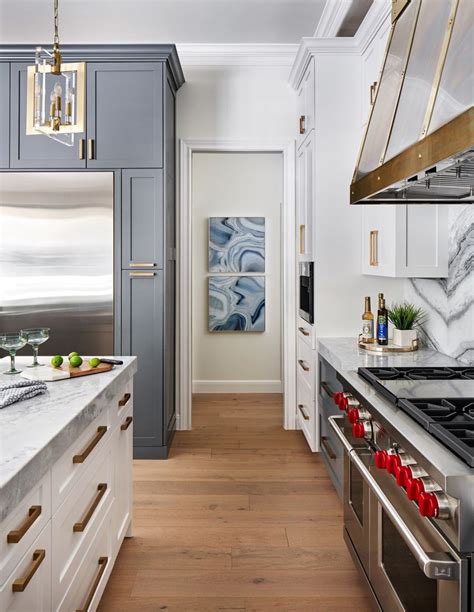 The people using the hood This stunning kitchen with a full height marble backsplash ...