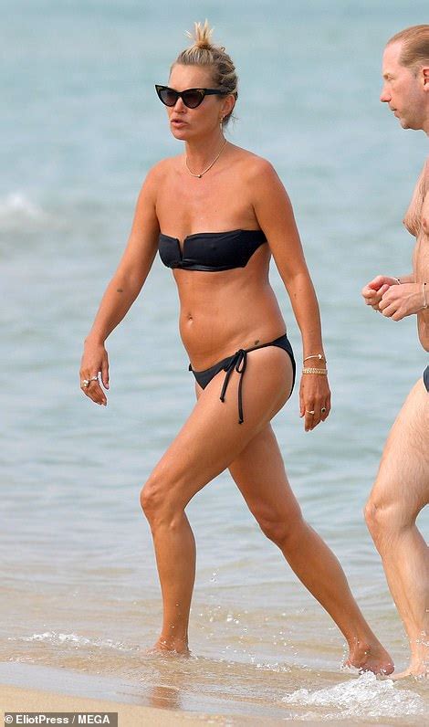 Kate Moss Exhibits Her Supermodel Frame In Tiny Black Bandeau
