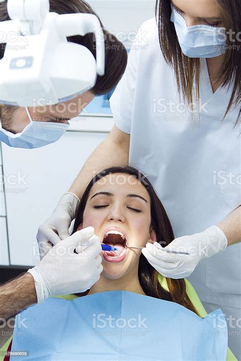 Cute Young Woman At The Dentist Mouth Checkup Stock Photo Download