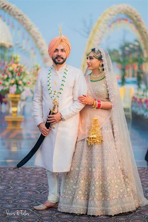Bride And Groom In Pink And Gold Saree And White Sherwani Punjabi Wedding Couple Indian