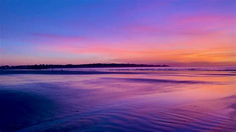 Spectacular Sunrise Reflects off Wet Sand