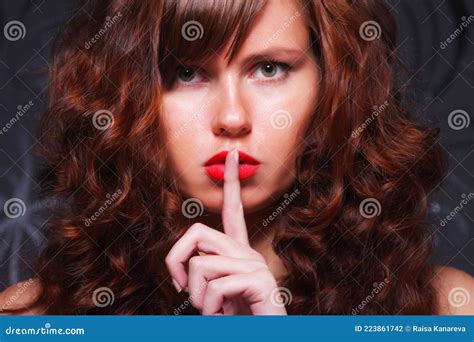 Portrait Of Brown Haired Gorgeous Young Lady Showing Shhh Taboo Sign