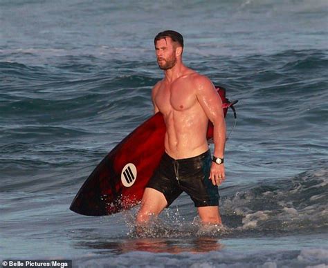 chris hemsworth showcases his abs as he goes shirtless while surfing chris hemsworth shirtless