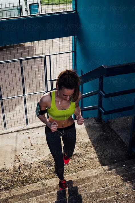 Fit Woman Running The Stairs By Stocksy Contributor Katarina Radovic Stocksy