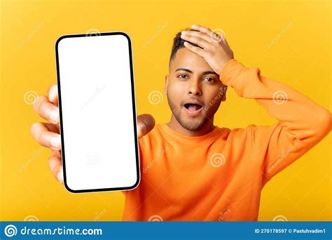 Surprised Smiling Man Freelancer Showing And Holding Smartphone With Empty Screen Amazed With