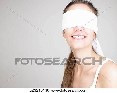 Woman Blindfolded Smiling Stock Photograph U Fotosearch