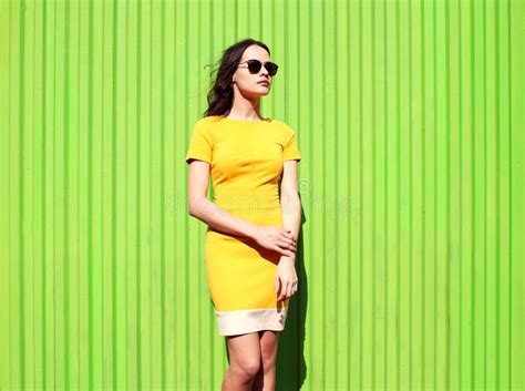 Fashion Beautiful Young Woman In Yellow Dress And Sunglasses Stock