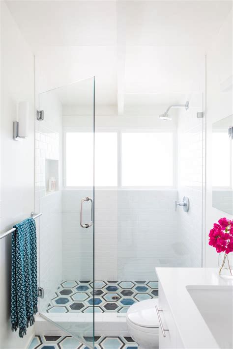 Tile floors allow for heated flooring systems that warm your feet while you're in the bathroom. Updated Shower With Glass Door & White Subway Tile | HGTV