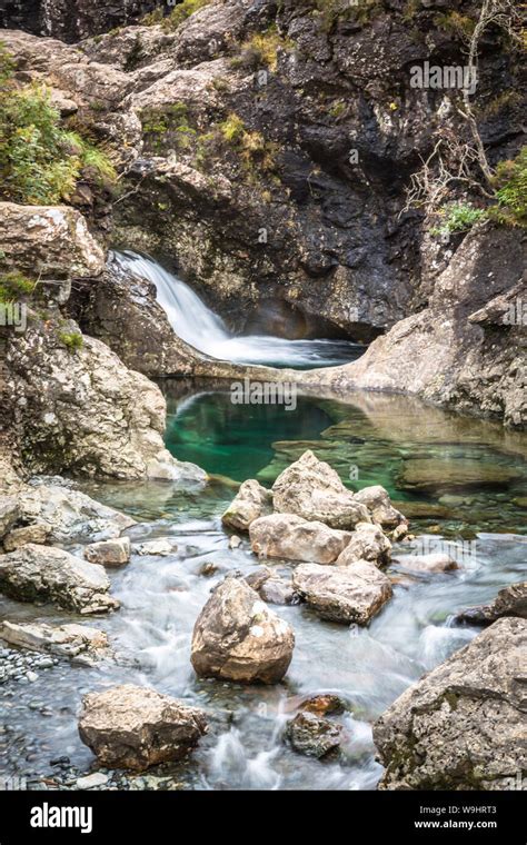 Fairy Pools Waterfall On Isle Of Skye With Green And Blue Glacial Melt
